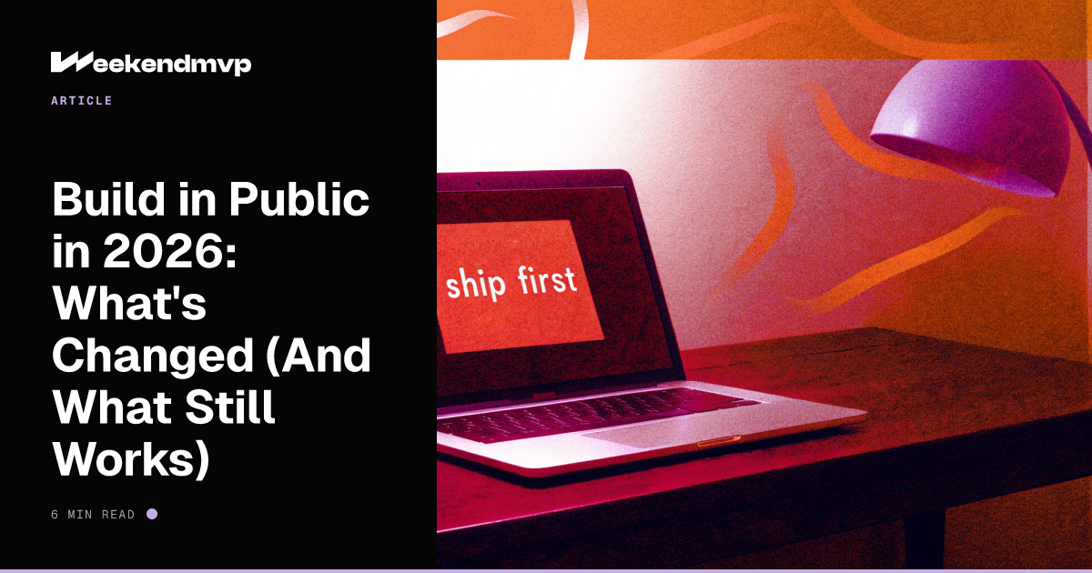 Laptop on a dark desk beside a sticky note that reads Ship first, lit by a lavender desk lamp